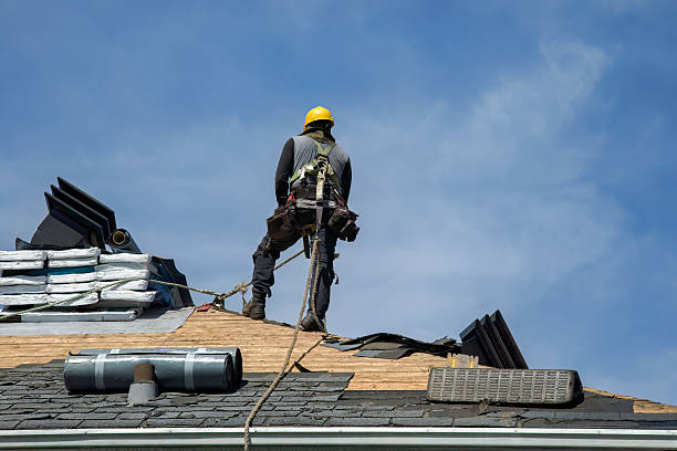 Professional Roofing technician working in Lansing, NY